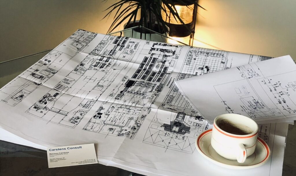 General arrangement drawings spread out on a desk