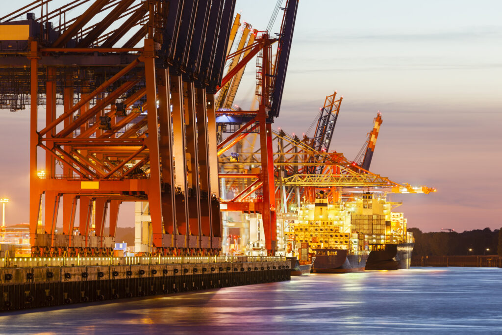 Container cranes working a vessel at a terminal quay